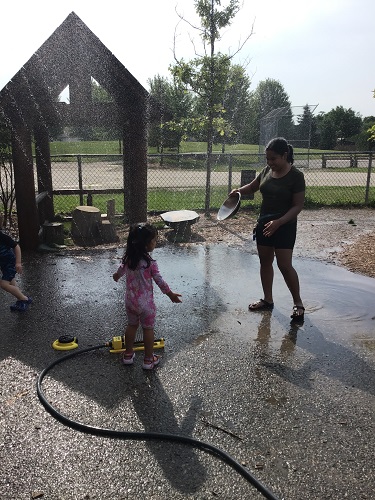 Toddlers engaging in water play