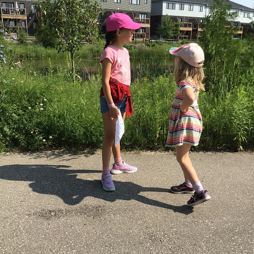 2 children standing on a path.