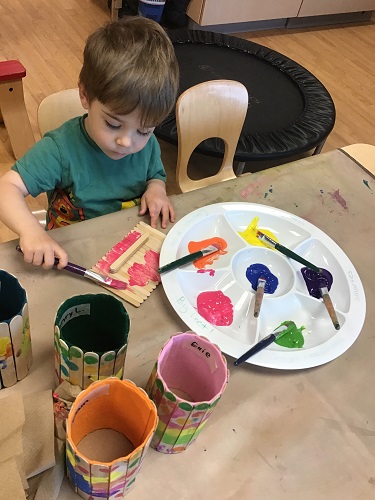 A child painting a father's day gift