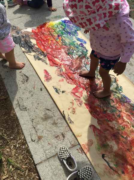 girl painting with her feet