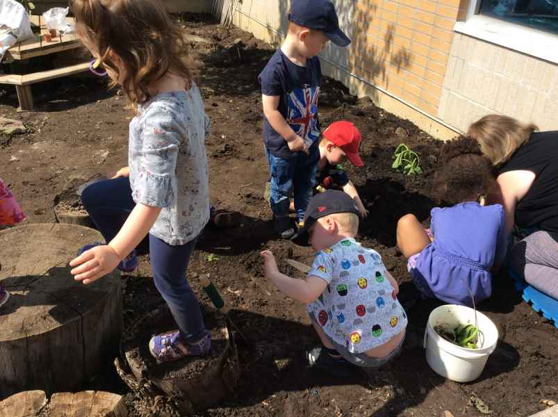 children planting seeds in their centre