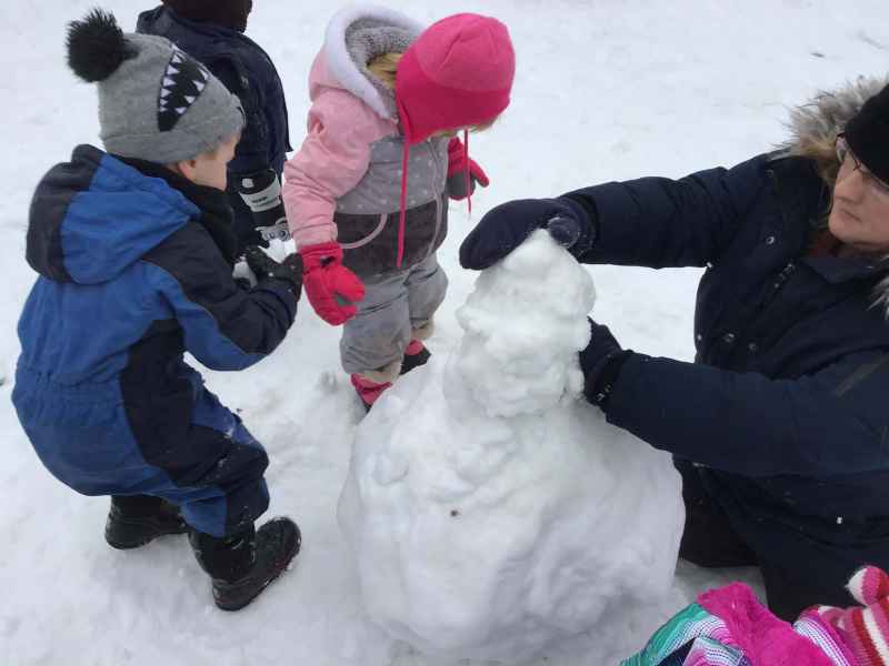 children building a snowman