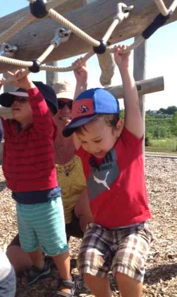 toddlers swimming from ropes