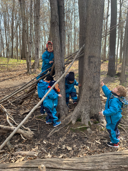 kids climbing on logs