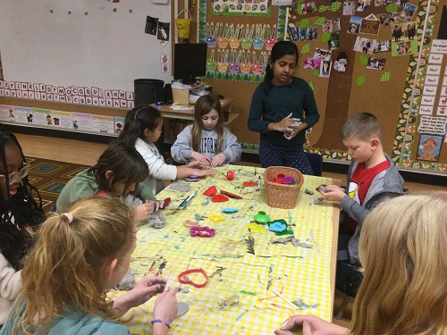 Children at table moulding clay #2