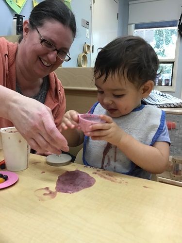 Child pouring into cup