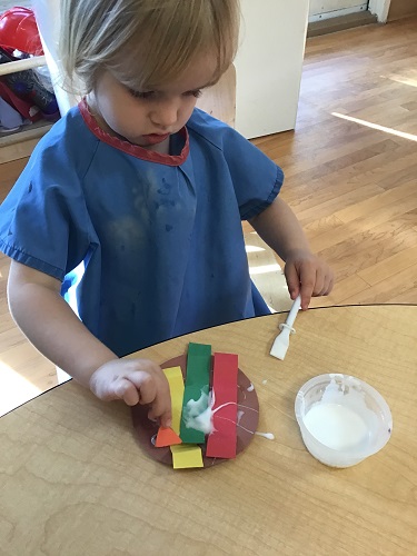 Evie gluing her Turkey 