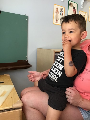 Child tastes food from garden
