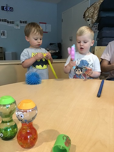 children exploring fidget toys