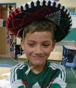 boy wearing a sombrero hat