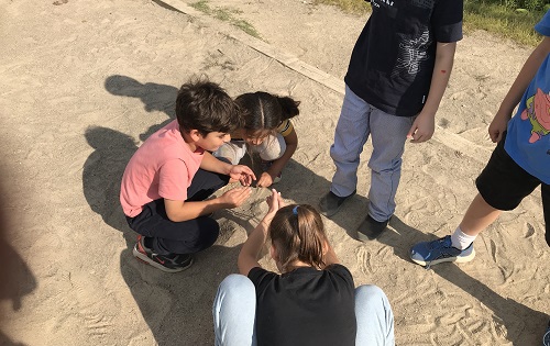 Children playing in the sand.
