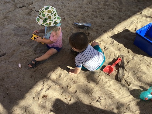 Children playing in the sandbox.