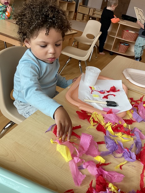 Child using tissue to make art