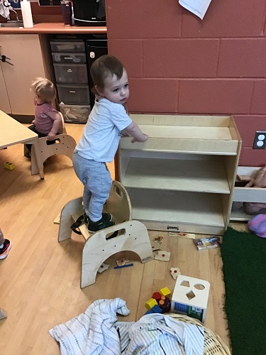 Child standing on a chair